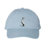 A baby blue DadHat cap featuring the #0029 printed design depicting a cat