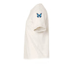 Un T-shirt blanc vintage à manches courtes et col rond, orné d'un motif représentant un arthropode sur le haut de la manche gauche.