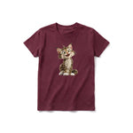 A maroon short-sleeve crewneck t-shirt for youth featuring a graphic of a cat on the front.