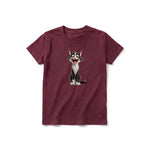 A maroon short-sleeve crewneck t-shirt for youth featuring a graphic of a cat on the front.