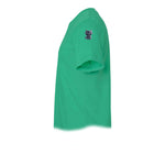 A kelly short-sleeve crewneck t-shirt  featuring a small graphic of a cat on the upper left sleeve.