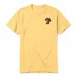 A mustard short-sleeve crewneck t-shirt for adult featuring a graphic of a dog on the left chest.