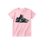 A pink short-sleeve crewneck t-shirt for youth featuring a graphic of a dog on the front.