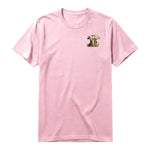 Un T-shirt rose à manches courtes et col rond, orné d'un motif représentant un animal de la ferme sur la poitrine gauche.
