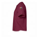 A maroon short-sleeve crewneck t-shirt  featuring a small graphic of a quirky bird on the upper left sleeve.