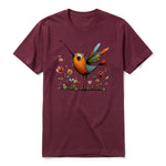 A maroon short-sleeve crewneck t-shirt for adult featuring a graphic of a quirky bird on the front.